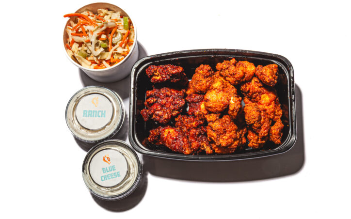 Single order of boneless wings from Woodie's Wings with slaw and a choice of ranch or blue cheese dip